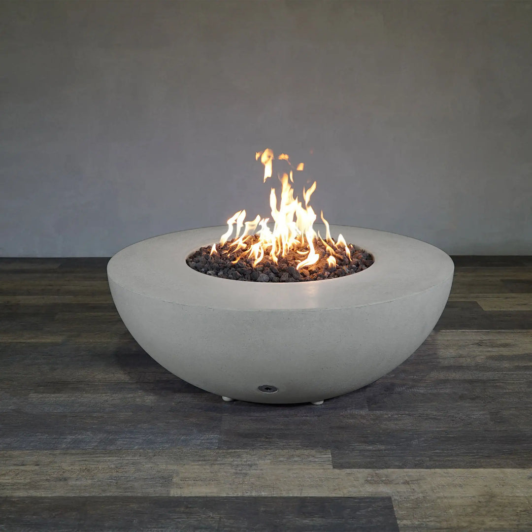 Full view of the Starfire Designs Rustic 45-inch Round Concrete Gravity Gas Fire Pit in Natural Gray, displaying its elegant design and functional appeal for any patio