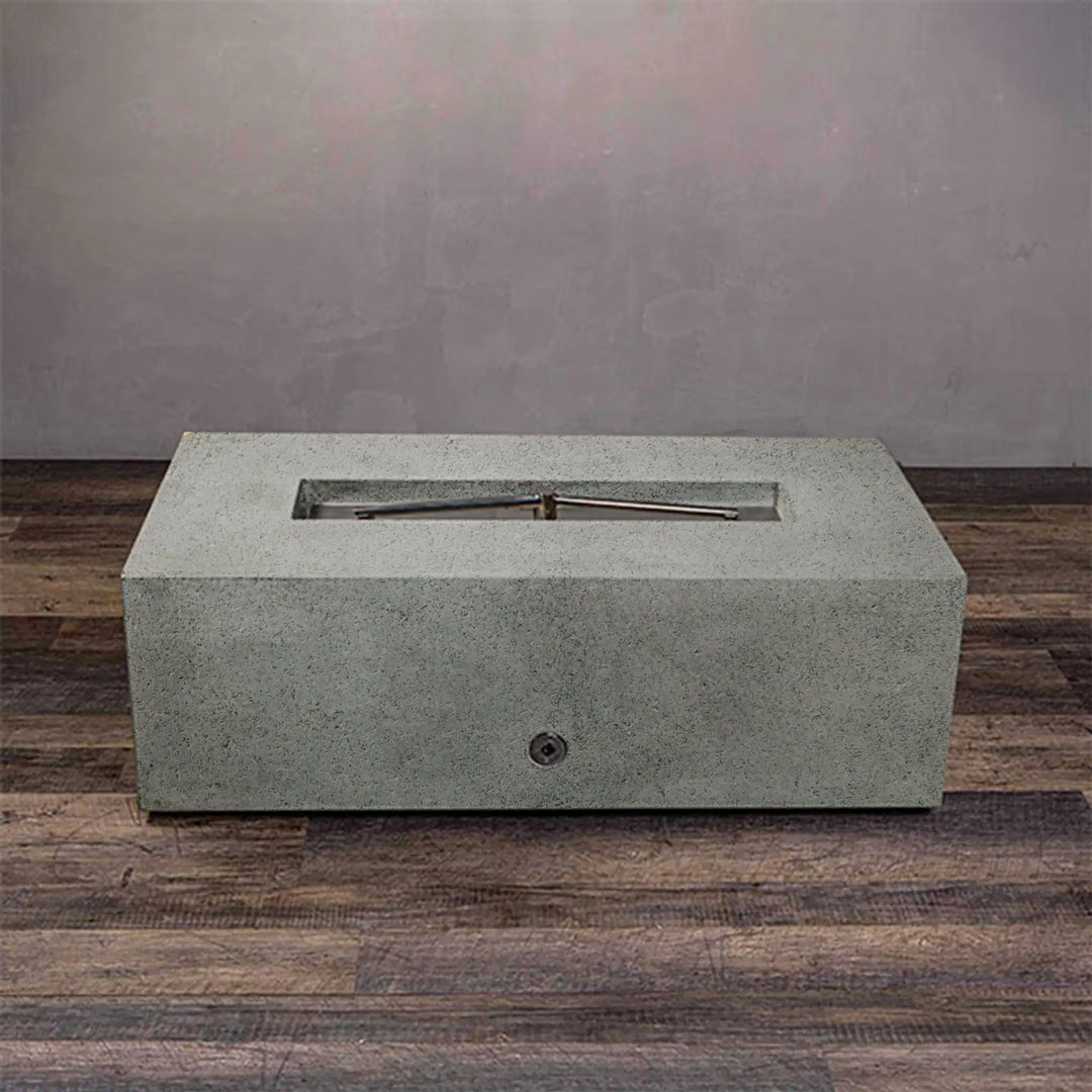 Side view of Starfire Designs rustic 48-inch x 32-inch rectangle concrete gravity gas fire pit in natural gray, showcasing the modern design suitable for luxury outdoor spaces