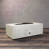 Angled view of a white concrete fire pit, ideal for outdoor fire table natural gas settings