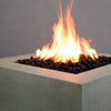 Close-up view of the Starfire Designs Rustic Gravity 36-inch Square Concrete Gas Fire Pit in beige with an intense flame, highlighting the sleek design and burning lava rocks