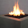 Close-up of the flames on the Starfire Designs Rustic Gravity 36-inch Square Concrete Gas Fire Pit in brown, emphasizing the vibrant fire and detailed concrete surface