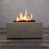 Front view of the Starfire Designs Rustic Gravity 36-inch Square Concrete Gas Fire Pit in brown, with flames lit, displaying the warm and inviting fire feature