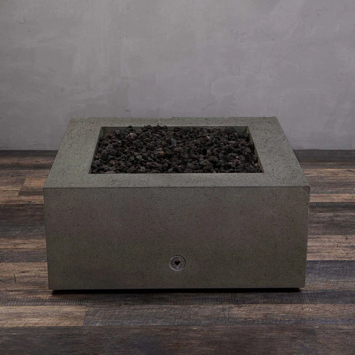 Front view of the Starfire Designs Rustic Gravity 36-inch Square Concrete Gas Fire Pit in brown, unlit, highlighting the modern design and lava rock filling