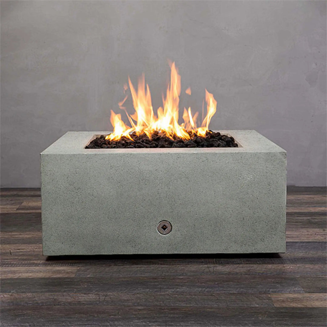 Front view of the Starfire Designs Rustic Gravity 36-inch Square Concrete Gas Fire Pit in Natural Gray, with a mesmerizing flame and natural lava rocks