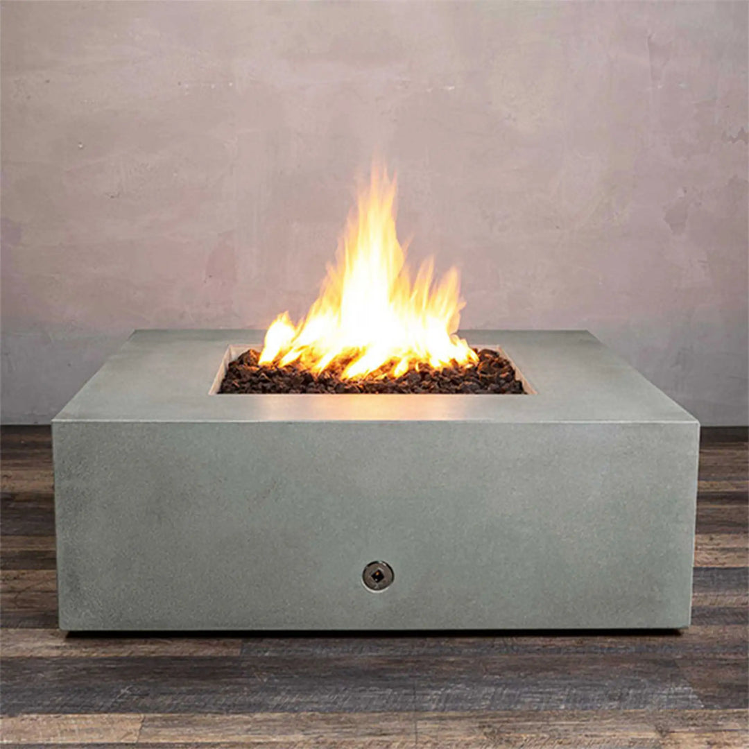 Front view of the Starfire Designs Rustic Gravity 45-inch square concrete gas fire pit in natural gray. This outdoor fire pit is designed with a durable concrete structure and features a modern square shape, perfect for luxury outdoor spaces