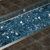 A close-up of Starfire Glass 1/2" Broken Fire Glass (10lbs) in Pacific Blue Reflective showcased in a stainless steel fire pit tray. The brilliant blue reflective glass intensifies the fire’s glow, creating a captivating effect. Perfect for modern gas fire pits, linear fire tables, and outdoor fireplaces, this durable fire glass ensures long-lasting performance and a stunning display.