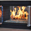 An elegant indoor fireplace filled with aqua Starfire Glass 1/4" broken fire glass (10lbs), with vibrant flames creating a cozy and luxurious indoor ambiance.