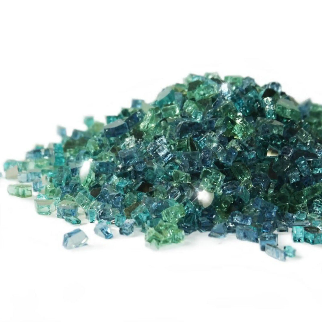 A stunning mound of Starfire Glass 1/4" Broken Pre-Mixed Fire Glass in Caribbean Blue (10lbs), showcasing a mix of deep ocean blue, teal, and clear fire glass. Designed for gas fire pits, fire bowls, and modern fire tables, this glass delivers a vibrant, beach-inspired aesthetic with exceptional heat resistance and longevity.