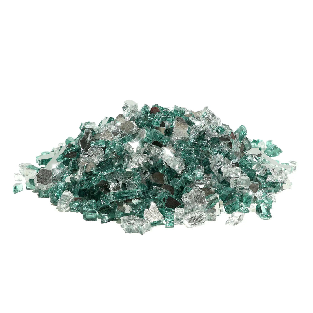 A cool and sleek blend of icy clear and light teal fire glass in the Starfire Glass 1/4" Broken Pre-Mixed Fire Glass in Water on Ice (10lbs). This fire pit glass enhances modern fire pits, gas fireplaces, and outdoor fire features, reflecting firelight beautifully for a high-end, contemporary look.