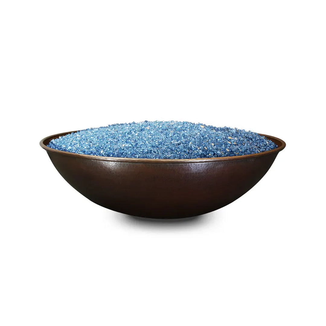 Wide, shallow copper bowl fire pit filled with blue fire glass, showcasing a smooth, polished surface for a luxurious modern outdoor setting.