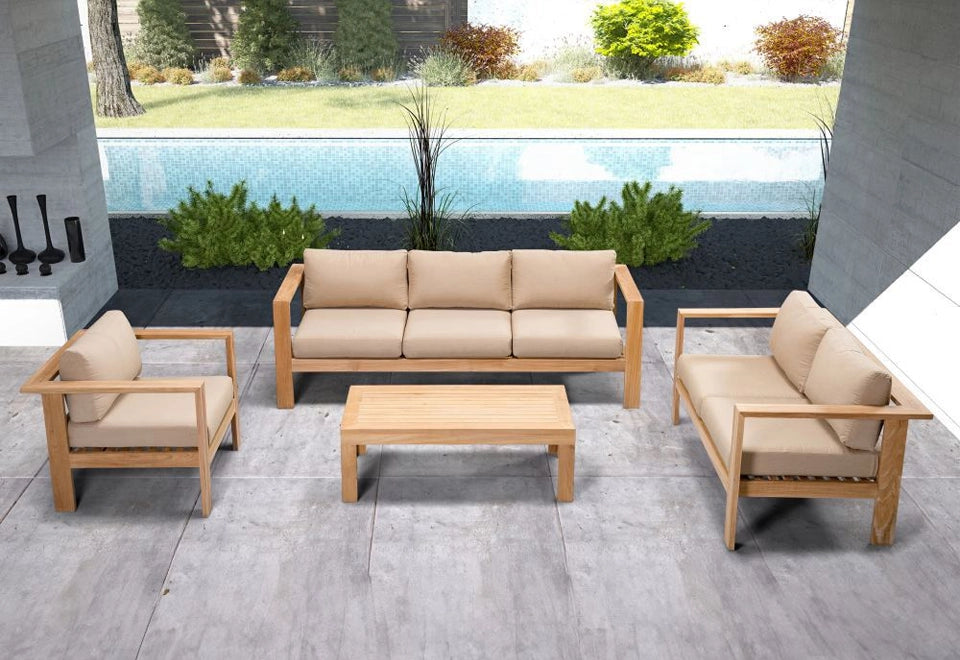 Elegant teak outdoor seating set with beige cushions, featuring a sofa, armchairs, and a matching coffee table, perfectly arranged on a modern patio by the poolside.