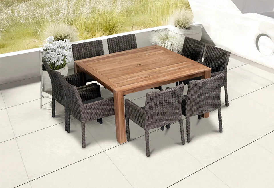 Elegant teak patio dining set with a square wooden table and six comfortable wicker chairs in a modern outdoor setting with greenery.