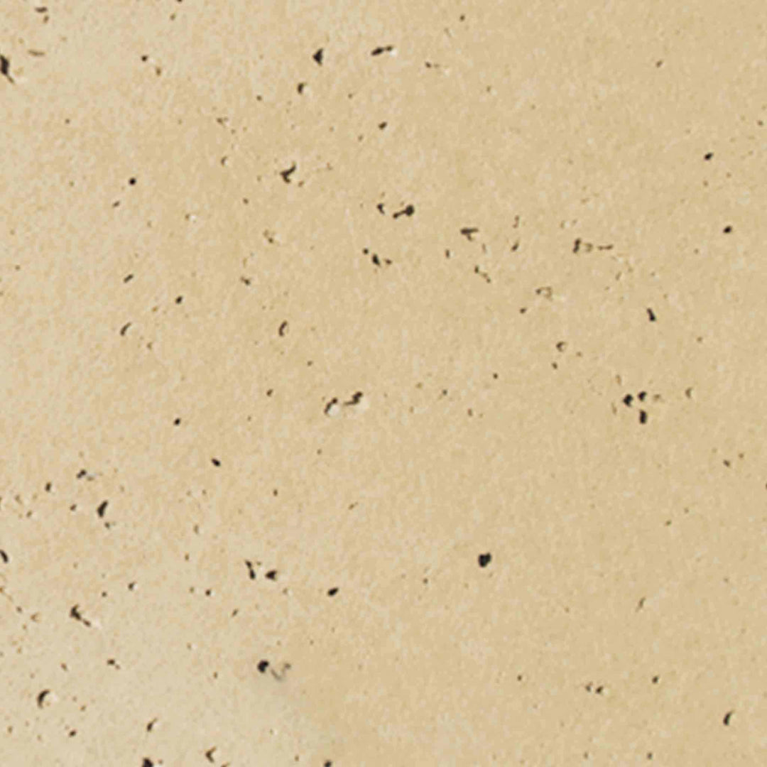 Detailed image of the vanilla-colored concrete swatch from The Outdoor Plus 24-inch Round Cazo Fire and Water Bowl, featuring a smooth and light finish that brings a subtle elegance to outdoor fire and water installations. This finish works well in various outdoor designs, offering a clean and sophisticated look