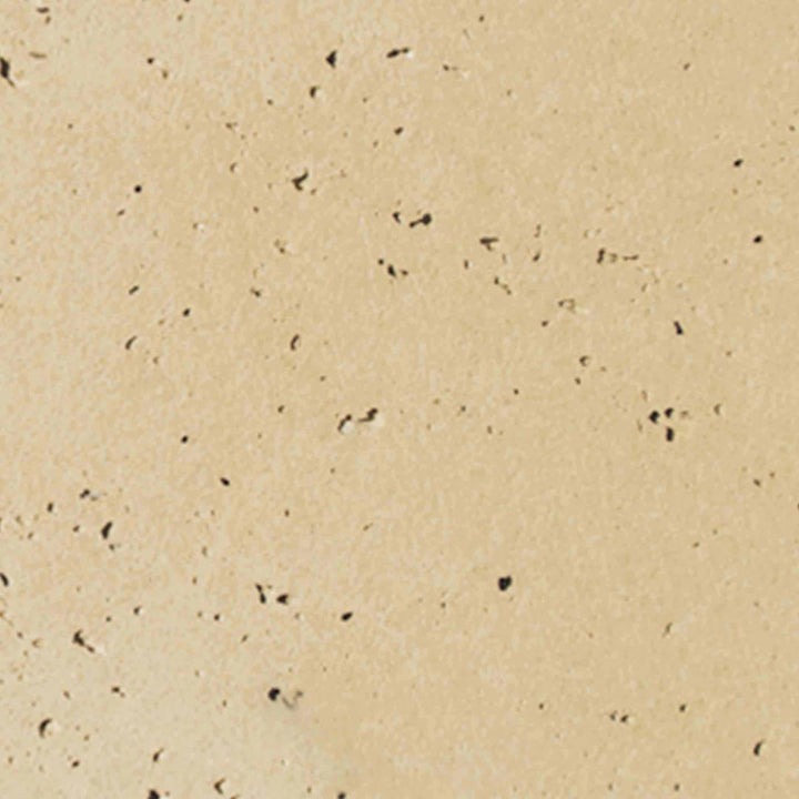 Detailed image of the vanilla-colored concrete swatch from The Outdoor Plus 24-inch Round Cazo Fire and Water Bowl, featuring a smooth and light finish that brings a subtle elegance to outdoor fire and water installations. This finish works well in various outdoor designs, offering a clean and sophisticated look