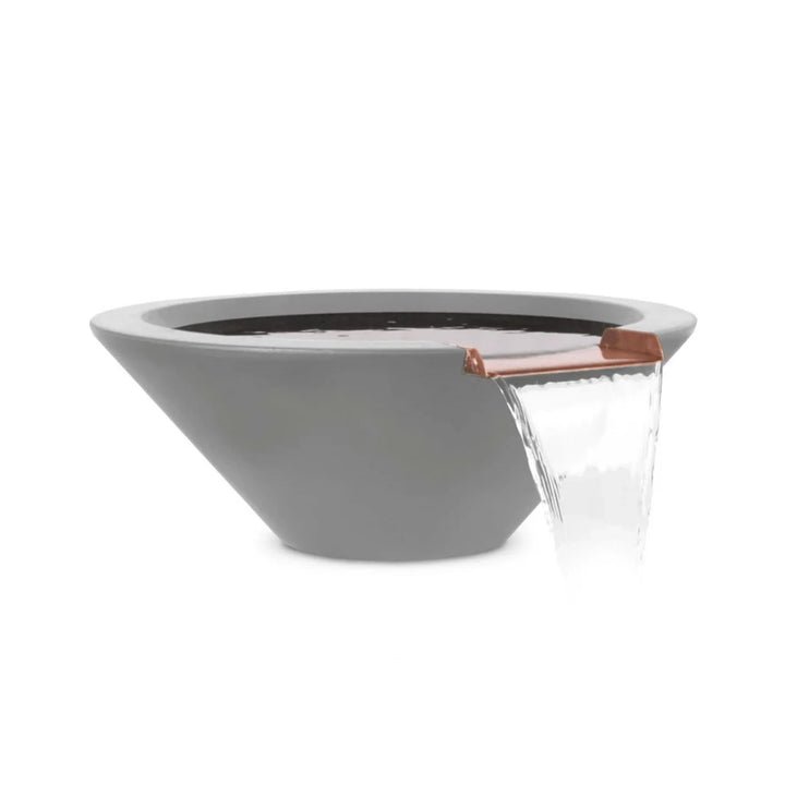 The Outdoor Plus 24" Round Concrete Cazo Water Bowl in ash color. A sleek round bowl made from durable concrete with a smooth ash finish, featuring a beautiful copper spillway for the water to flow over. This elegant water bowl is ideal for enhancing outdoor spaces with a modern and minimalistic aesthetic, perfect for garden or patio settings.