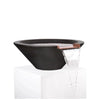 The Outdoor Plus 24" Round Concrete Cazo Water Bowl in black color. A round, contemporary water bowl constructed from solid concrete with a deep black finish, complemented by a copper water spillway that adds a refined touch. The bowl is designed to create a tranquil and modern water feature for any outdoor space.