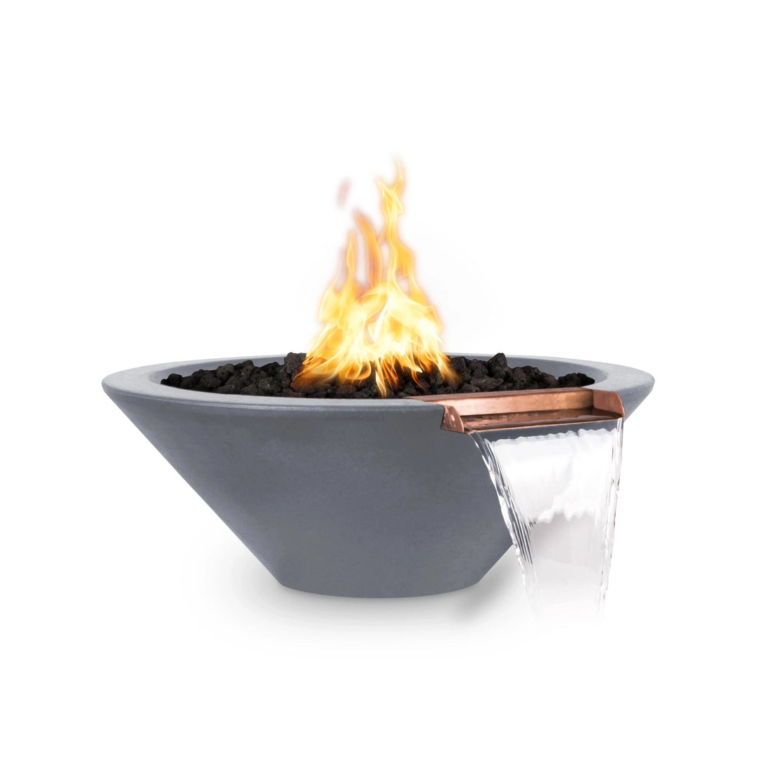 The Outdoor Plus 31" Round Concrete Cazo Fire and Water Bowl in gray color, designed with a stylish gray concrete body and a copper water spout. It brings the harmony of fire and water to poolside or backyard settings, making it a sophisticated addition to modern outdoor areas.