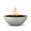 The Outdoor Plus 33" Round Concrete Sedona Fire Bowl in ash finish, showcasing a steady flame and smooth water flow from the copper spillway. This handcrafted fire bowl is made from durable concrete, perfect for adding luxury to outdoor spaces. Ideal for fire pit setups and water feature combinations.