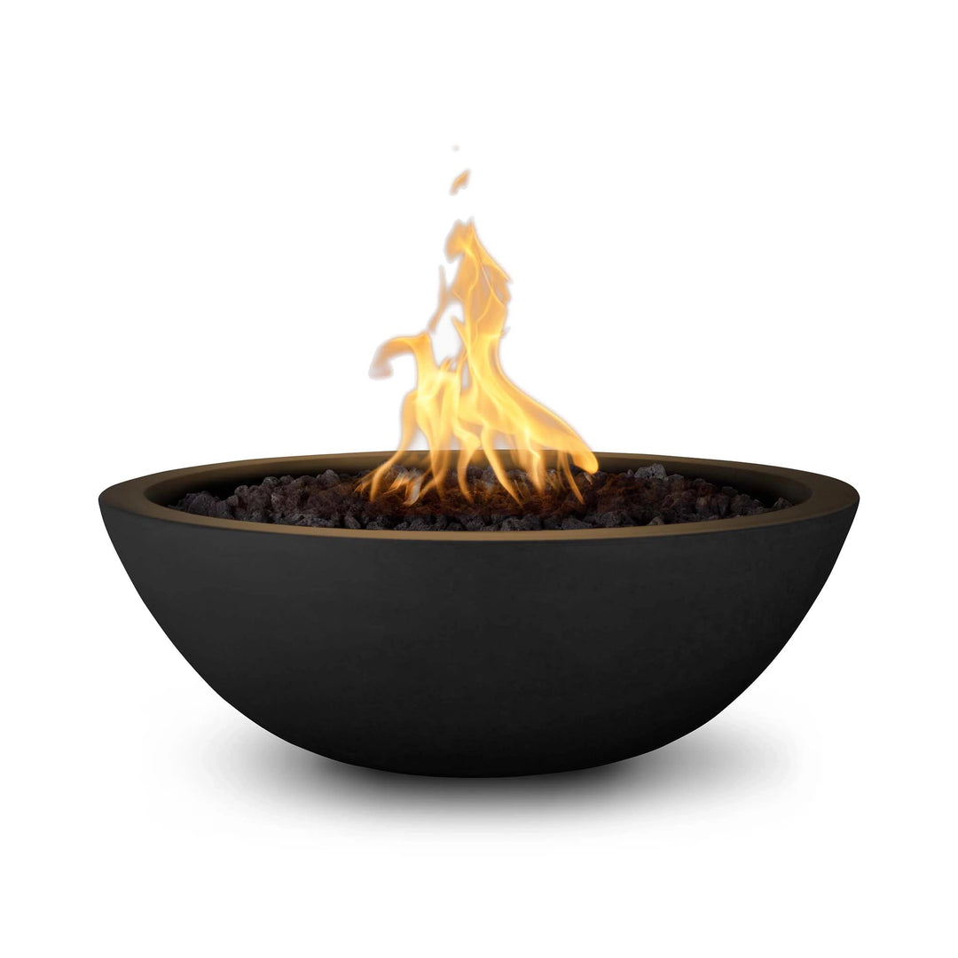 The Outdoor Plus 33" Round Concrete Sedona Fire Bowl in black finish, featuring a striking flame with water cascading elegantly from the copper spout. This premium outdoor fire bowl is designed to enhance patios and landscape designs with a modern touch.