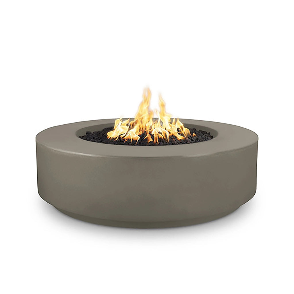 The Outdoor Plus 42-inch Occasional Height Florence Concrete Gas Fire Pit in ash finish, features a wide round surface with a built-in fire bowl, ideal for modern outdoor spaces. This concrete fire pit offers a sleek design with a durable finish, providing warmth and style for backyard gatherings. Suitable for both propane and natural gas configurations, this ash-colored fire pit is perfect for patios and gardens