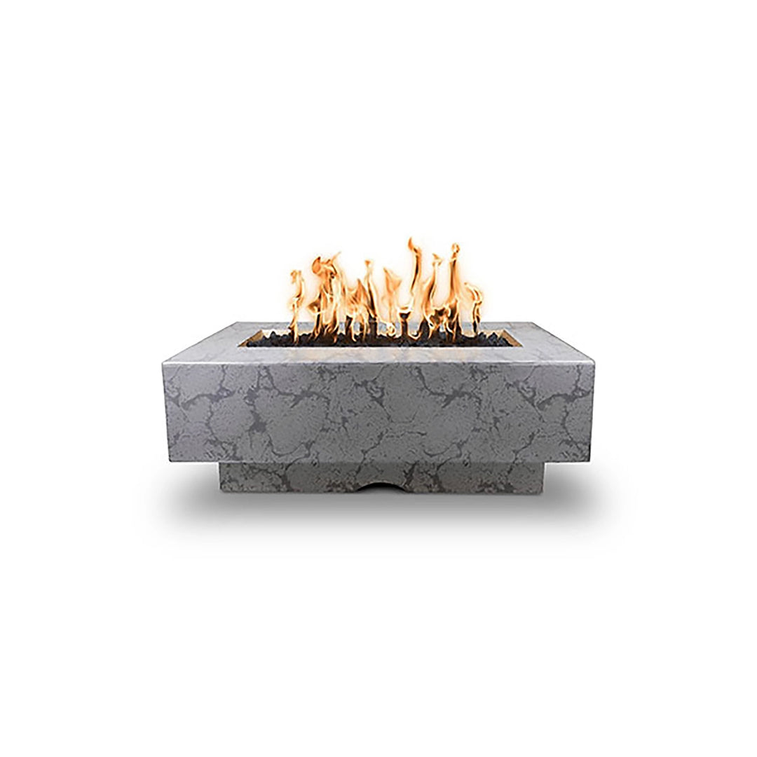 The Outdoor Plus 48" Del Mar Concrete Gas Fire Pit in rustic gray finish, featuring a weathered, distressed texture that mimics natural stone. The rectangular design with an integrated base adds a rustic charm to contemporary outdoor spaces, making it a versatile fire feature for both residential and commercial patios. 