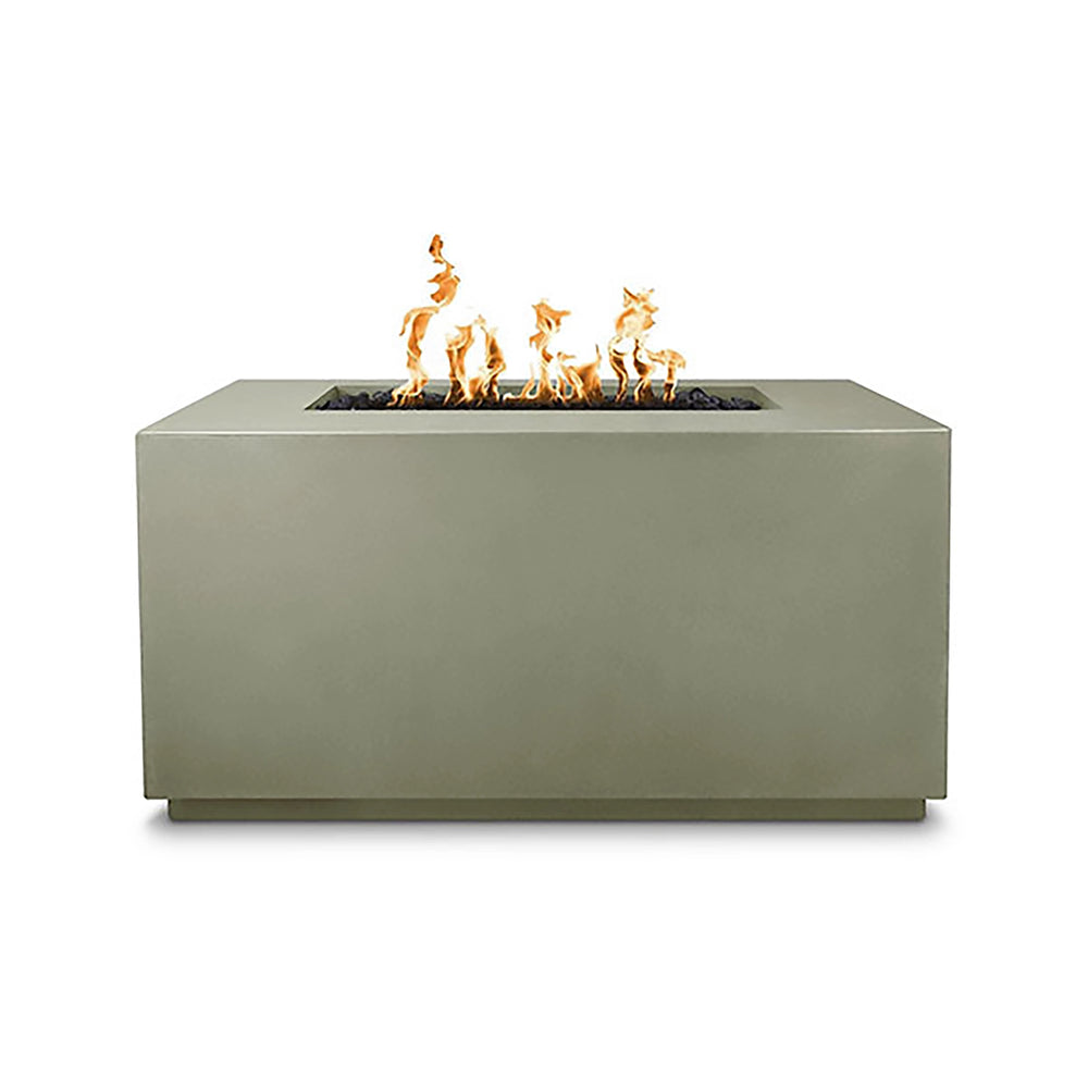 The Outdoor Plus 48-inch Pismo Concrete Gas Fire Pit in ash finish, showcasing a sleek and minimalist rectangular design. This premium concrete fire pit features a center rectangular burner filled with black lava rock and an extended flame pattern, creating a warm and inviting atmosphere for any outdoor space. Ideal for contemporary patio settings, this luxury fire pit offers both functionality and style for modern backyard aesthetics. 