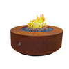 The Outdoor Plus 48-inch Round Unity Fire Pit in a corten steel finish featuring a rustic, weathered appearance. The fire pit’s thick walls and smooth round design provide a contemporary look, while the vibrant blue fire glass enhances the flame’s visual appeal. Perfect for modern outdoor settings and backyard gathering spaces. 
