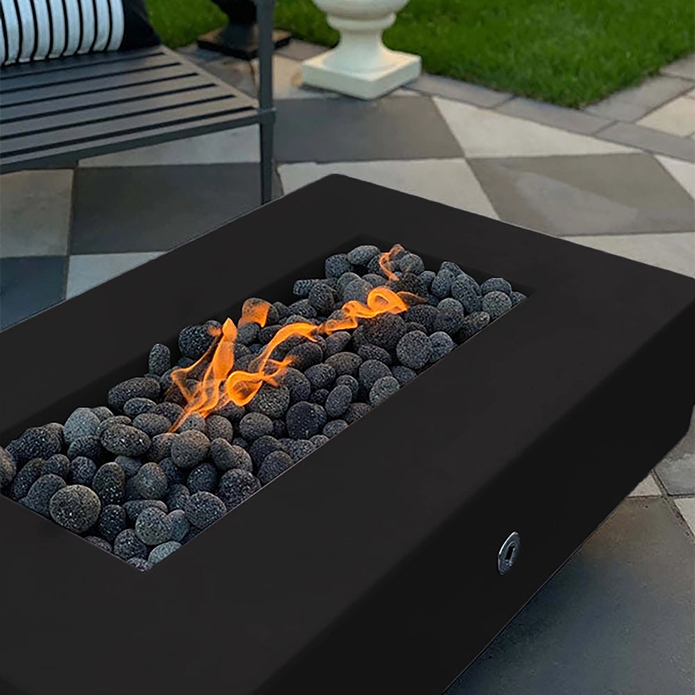 The Outdoor Plus 60-inch Del Mar Concrete Gas Fire Pit in a bold black color, showcasing sleek, dark concrete with flames illuminating lava rocks. Perfect for a modern, sophisticated outdoor space, this gas fire pit brings warmth and style to backyard gatherings.