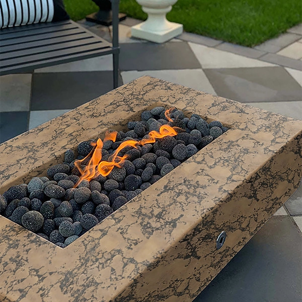 The Outdoor Plus 60-inch Del Mar Concrete Gas Fire Pit in a rich coffee color, creating an inviting focal point for outdoor spaces. Featuring dark lava rocks and a steady flame, this gas fire pit brings warmth and style to modern backyards and patios.