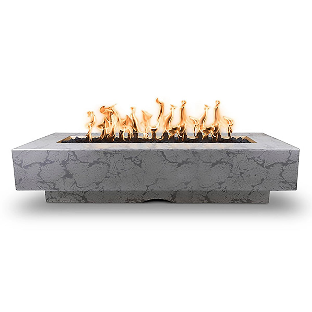 The Outdoor Plus 84" Del Mar Concrete Gas Fire Pit in Rustic Gray. Exhibits a rustic design paired with vibrant flames, blending modern and classic outdoor elements effortlessly.