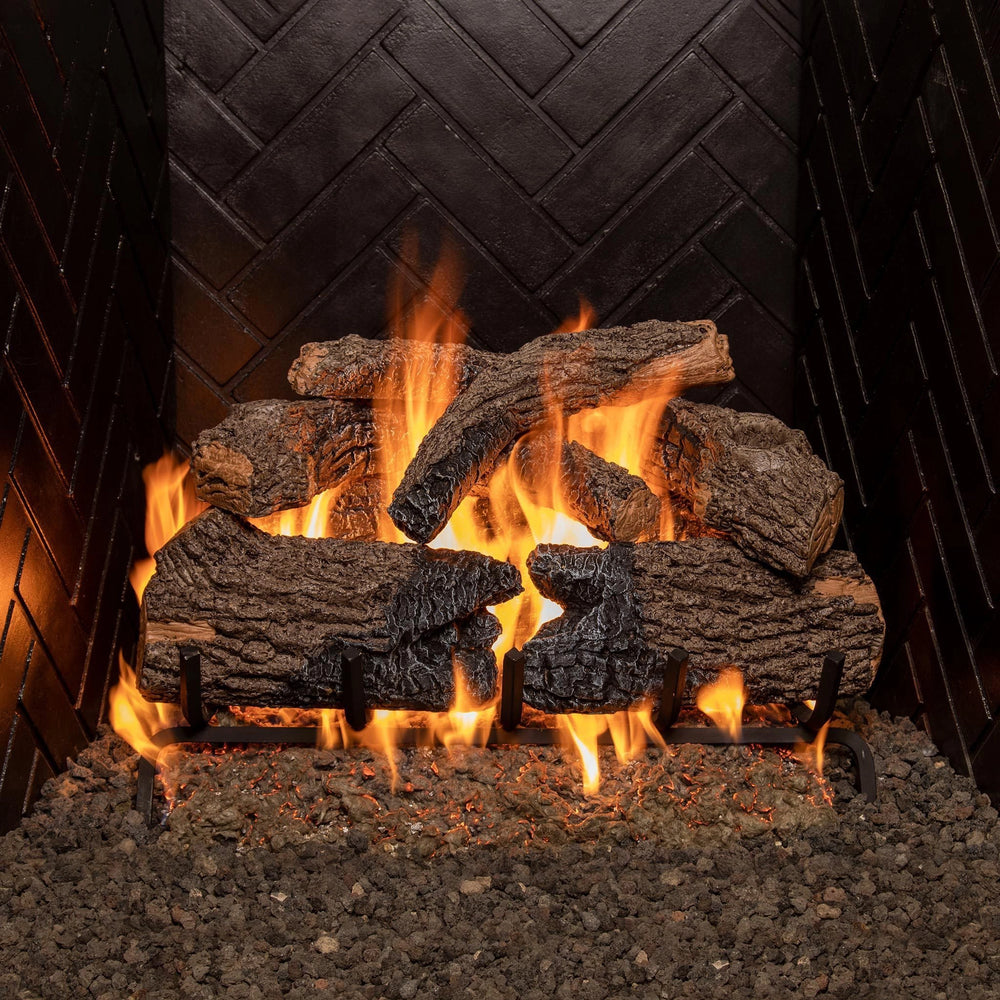 24-inch Real Fyre Vented Charred Oak Gas Logs with vibrant flames in a fireplace setup. The stacked logs and realistic charred oak finish create a warm, inviting glow, perfect for enhancing any vented gas fireplace's ambiance.