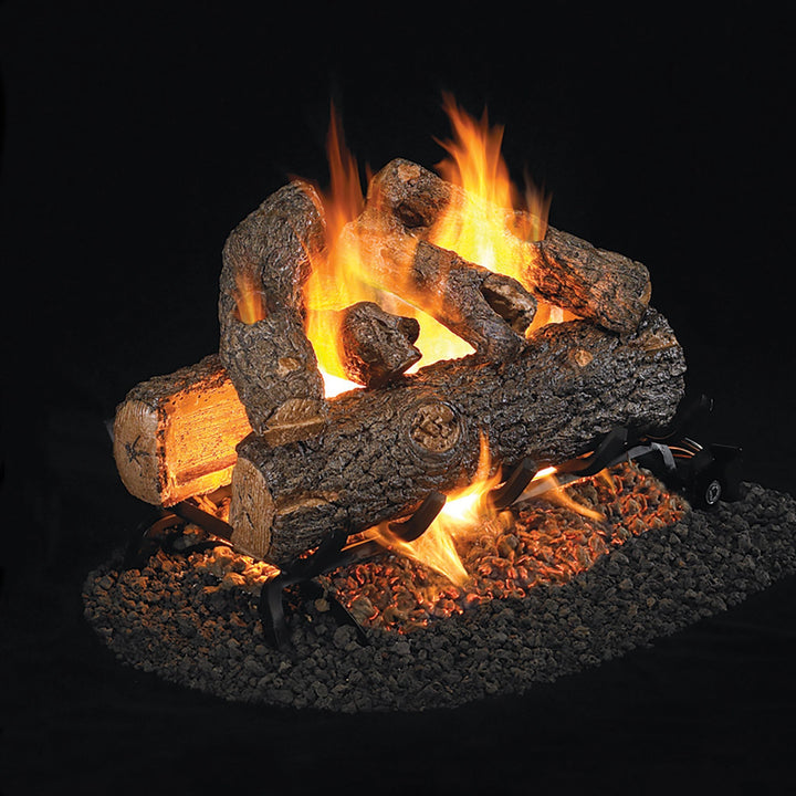 A side view of the Vented Designer Plus Gas Logs Golden Oak by Real Fyre, showcasing realistic hand-painted oak logs in a blazing fire. The detailed wood texture and embers provide an authentic fireplace experience. Perfect for adding warmth and ambiance to any indoor fireplace setup. This natural gas log set is designed to offer efficient heating with a traditional aesthetic.