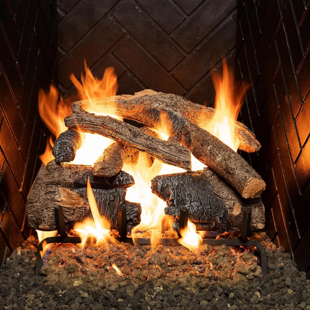 Real Fyre Vented Charred American Oak Gas Logs 18 inch set ignited in a fireplace, producing vibrant flames around realistic charred oak logs with detailed wood grain texture. Enhances ambiance in vented gas fireplaces.