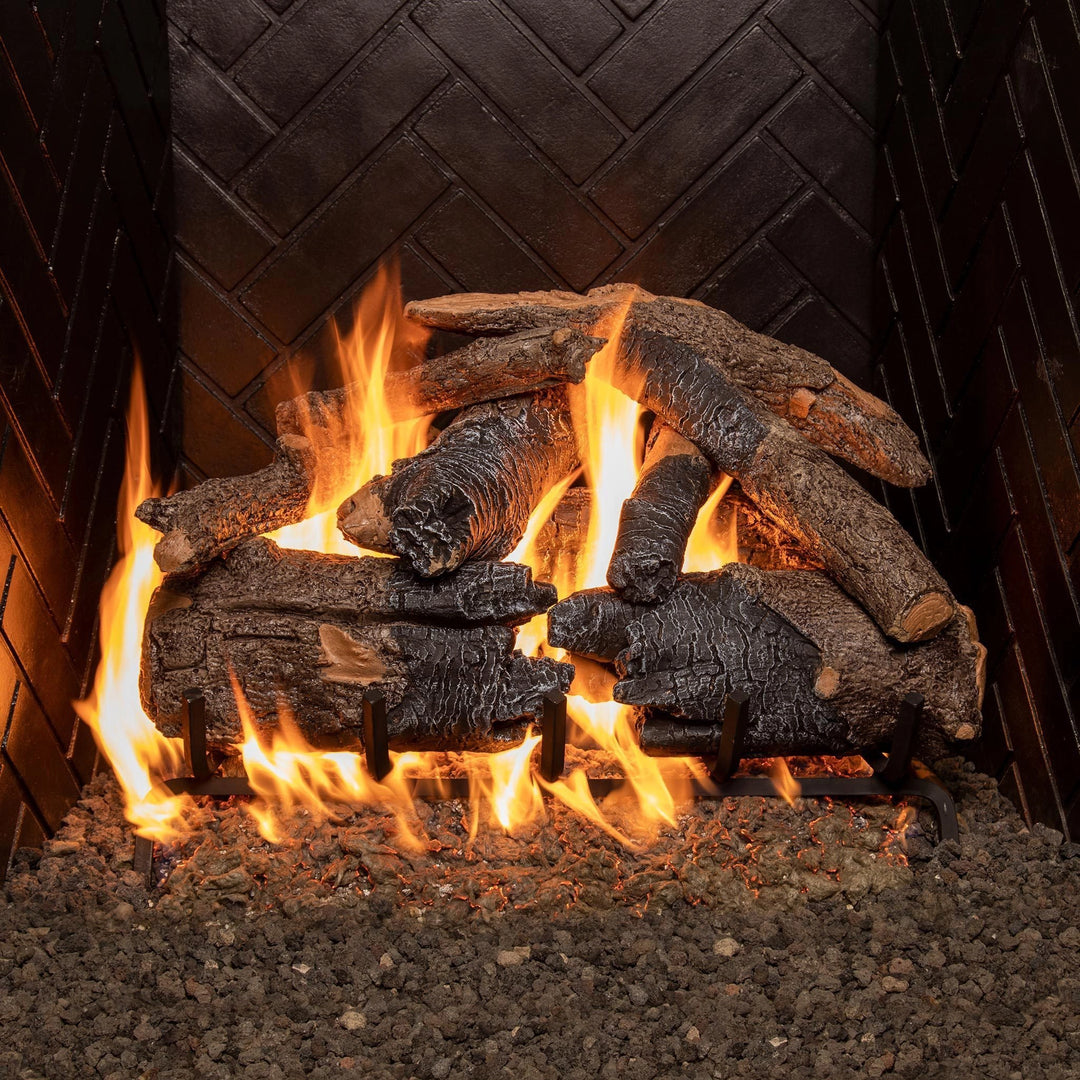 24-inch Real Fyre Vented Charred American Oak Gas Logs stacked with realistic flames in a gas fireplace. The logs exhibit detailed charred textures and natural oak patterns, creating a warm and inviting ambiance ideal for vented gas fireplaces.