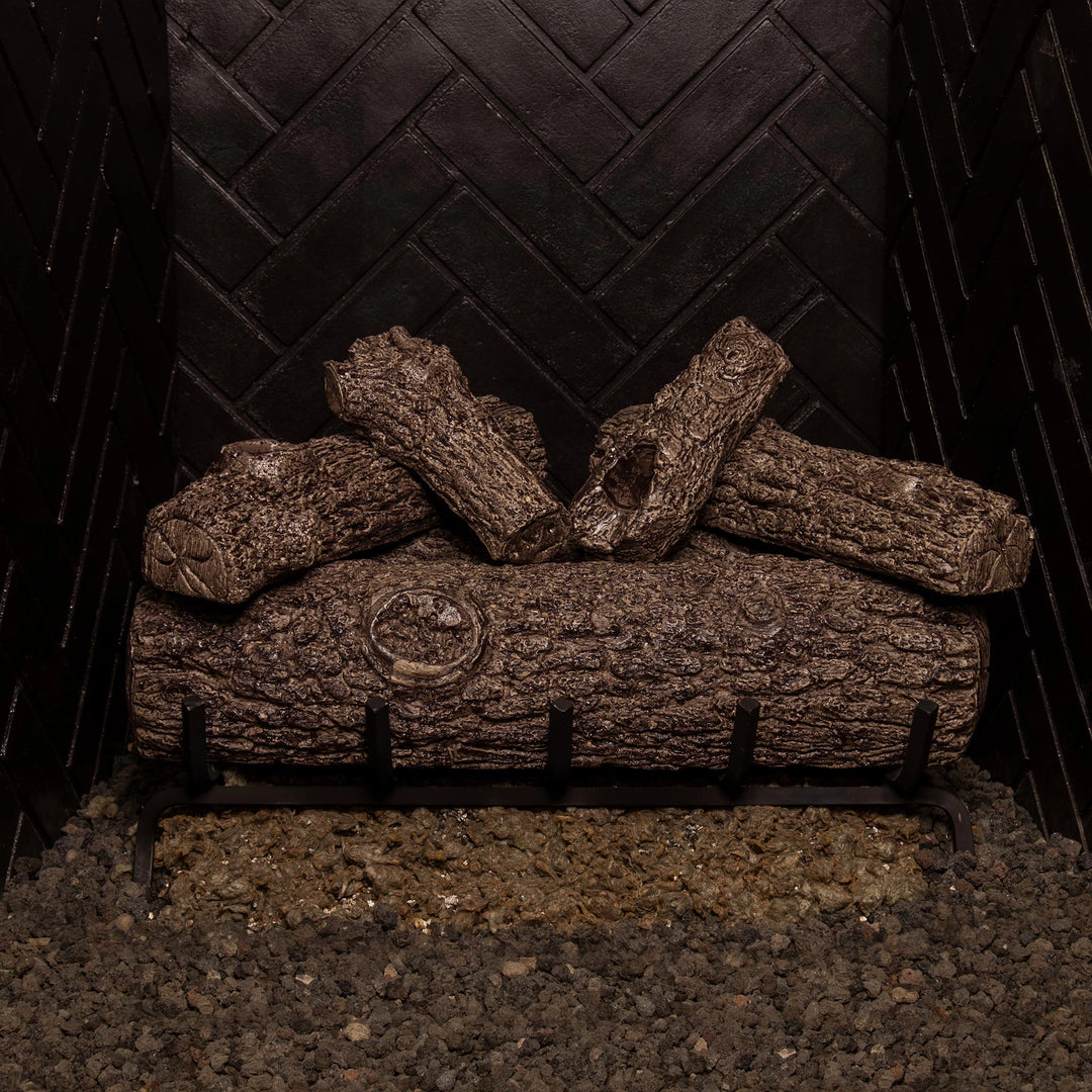 Real Fyre 24-inch Golden Oak vented gas logs shown unlit, displaying intricate details and lifelike oak textures. Crafted for vented gas fireplaces, this ceramic log set offers a natural wood appearance, creating a stylish and authentic fireplace experience even without flames.