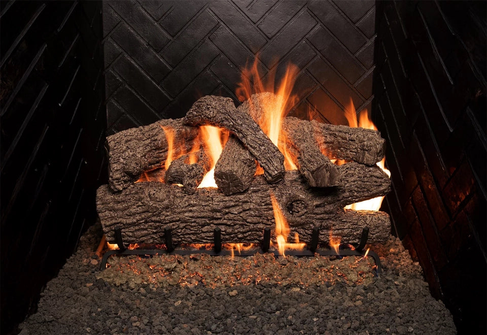 Realistic vented gas logs burning with natural-looking flames in a black herringbone brick fireplace, creating a cozy and elegant ambiance.