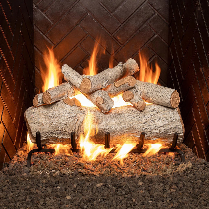 Real Fyre vented gas logs Mountain Birch set in 24 inches size, displayed in a gas fireplace with vibrant, glowing flames. The logs feature a rustic birch bark design with natural-looking textures and precise detailing, giving your fireplace a warm and inviting feel. These vented logs provide a realistic wood-burning appearance, perfect for anyone looking to enhance their fireplace with an easy-to-use gas option.