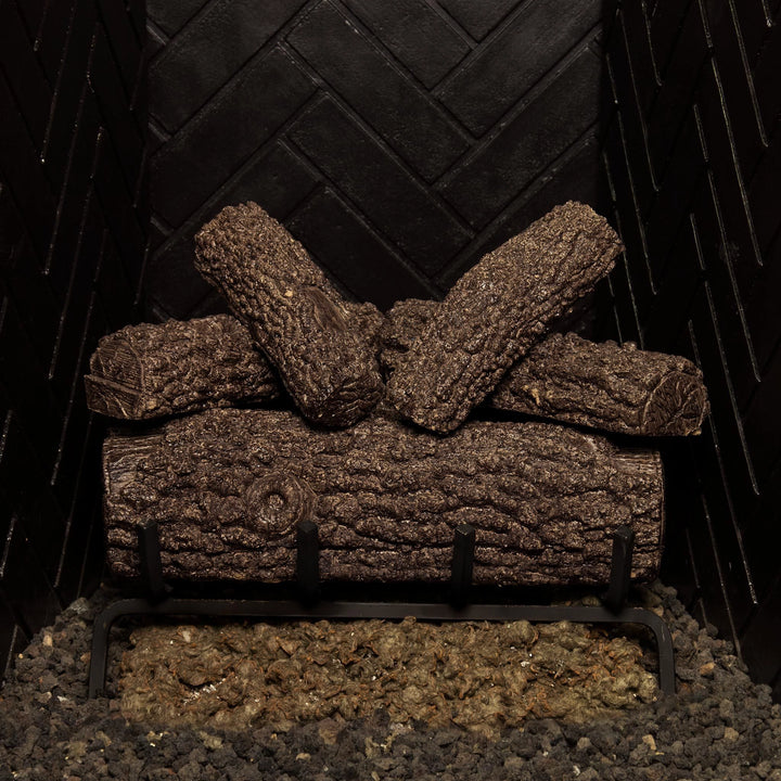 Real Fyre 18-inch Post Oak vented gas logs arranged on a durable grate, featuring lifelike textures and rustic charm for natural gas fireplaces when not in use.