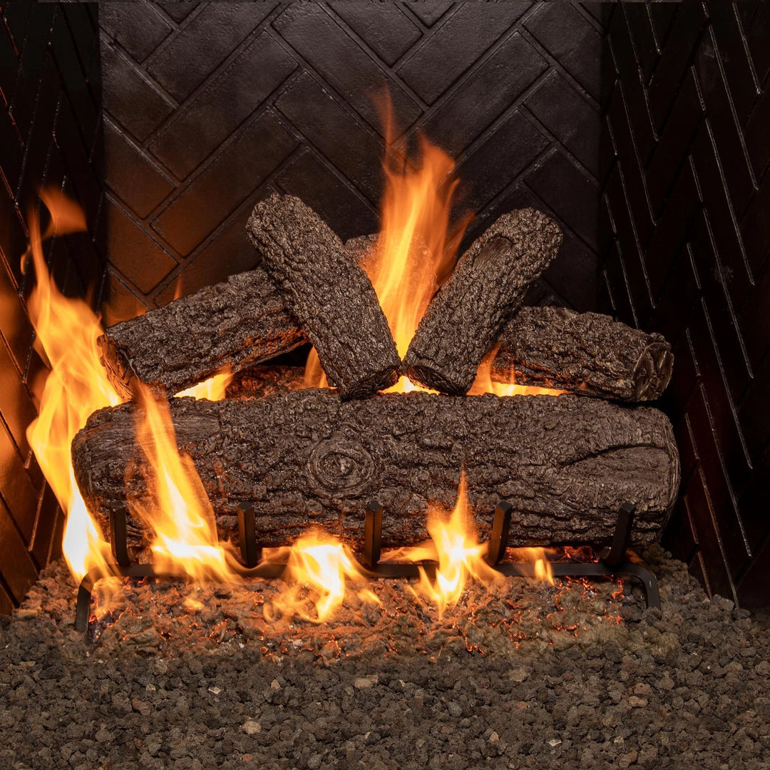 Real Fyre 24-inch Post Oak vented gas logs glowing with vibrant flames, offering realistic wood textures and a cozy ambiance for natural gas fireplaces.