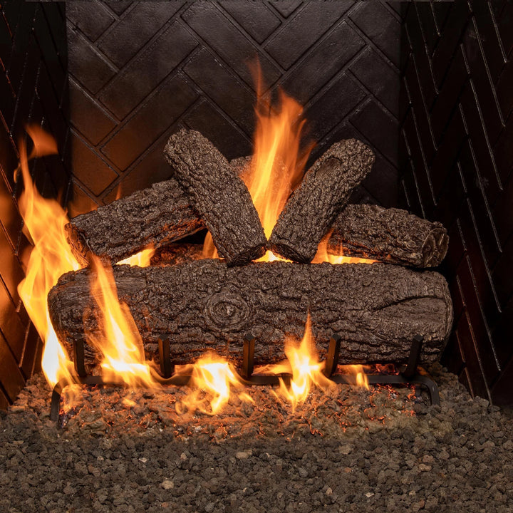 Real Fyre 24-inch Post Oak vented gas logs glowing with vibrant flames, offering realistic wood textures and a cozy ambiance for natural gas fireplaces.