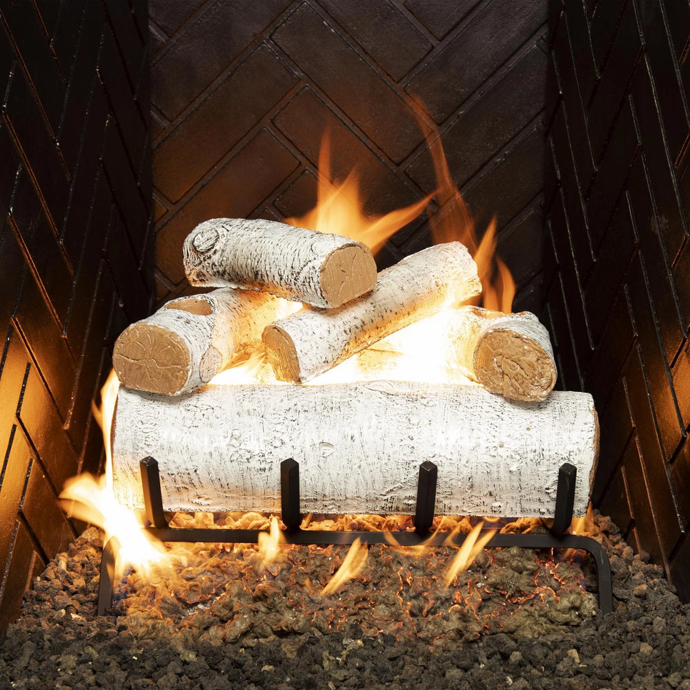 Real Fyre vented gas logs White Birch set, 18-inch size, with natural flames and glowing embers in a firebox. Enhances fireplaces with its authentic white birch look