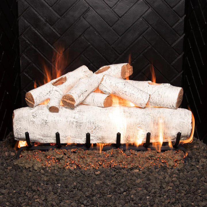 30-inch vented gas logs white birch by Real Fyre burning with vibrant orange flames, emphasizing the detailed white birch bark. A premium fireplace log set perfect for creating a warm, inviting ambiance in indoor spaces.