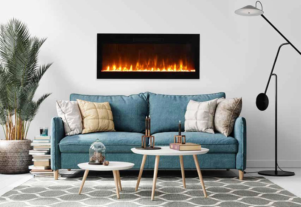 Modern wall-mounted electric fireplace with vibrant flames, enhancing a stylish living room with a blue sofa and minimalist decor. The ventless design provides warmth and ambiance, offering a safe and efficient heating solution for contemporary home interiors.