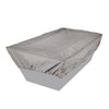 Tan rectangular fire pit cover securely fitted over a fire pit, providing protection from outdoor elements
