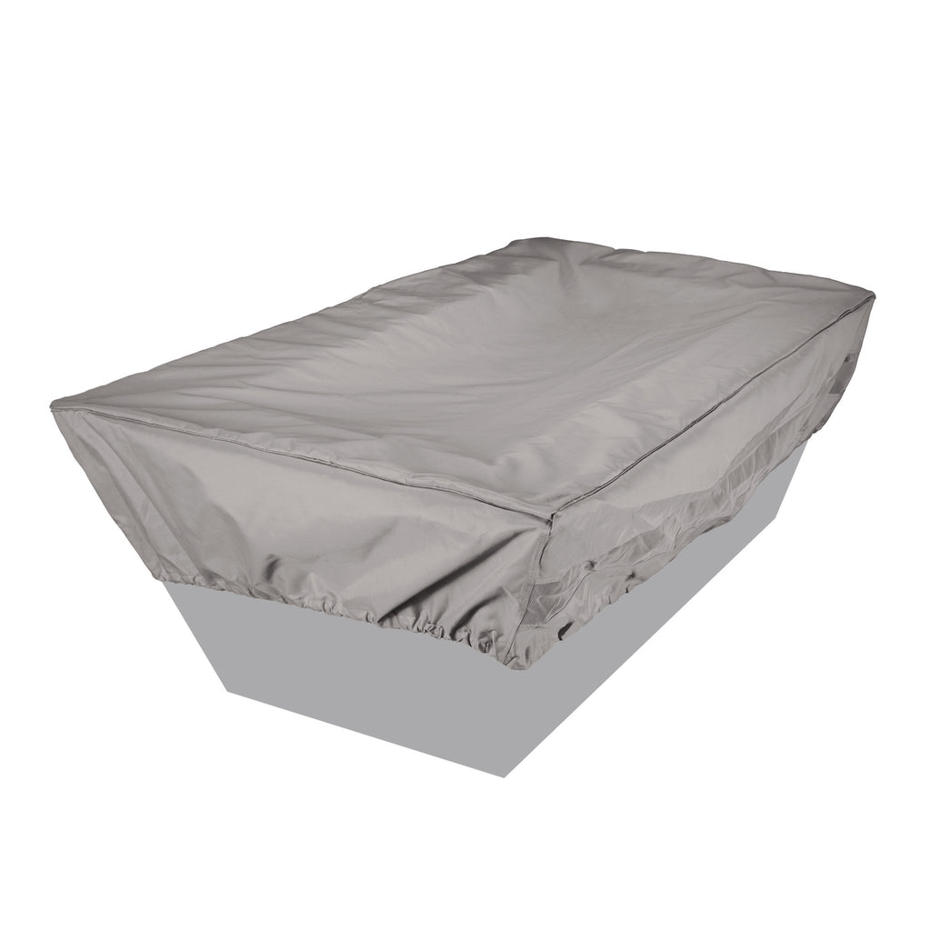 Tan rectangular fire pit cover securely fitted over a fire pit, providing protection from outdoor elements